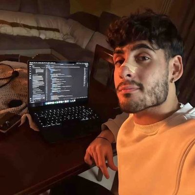 Francesco Mistero at his desk with a laptop
